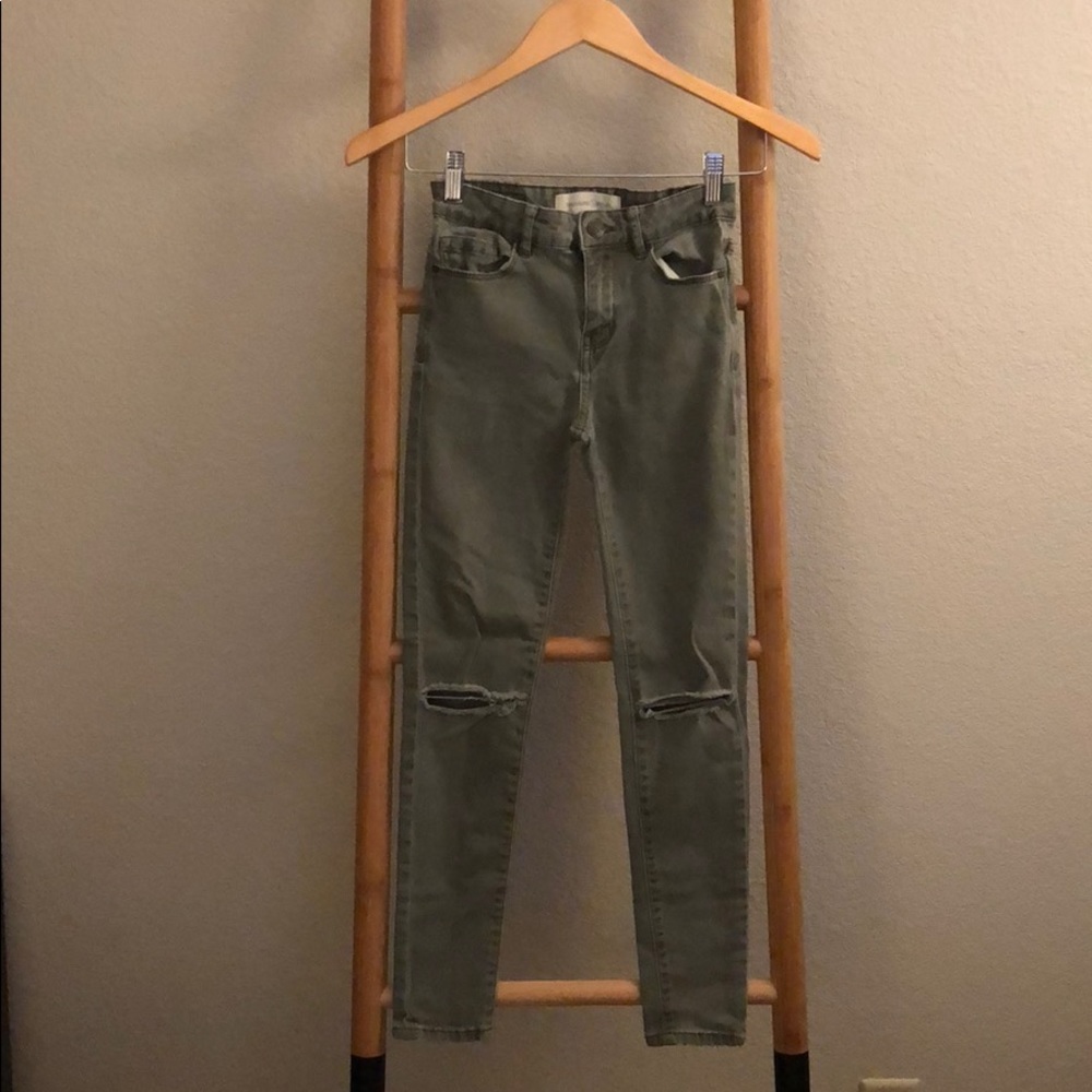 Army green ripped jeans